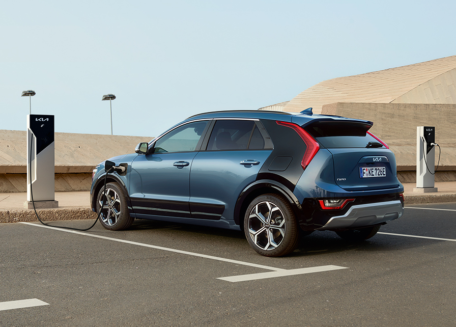 Kia Niro PHEV being charged via a public charging station. 